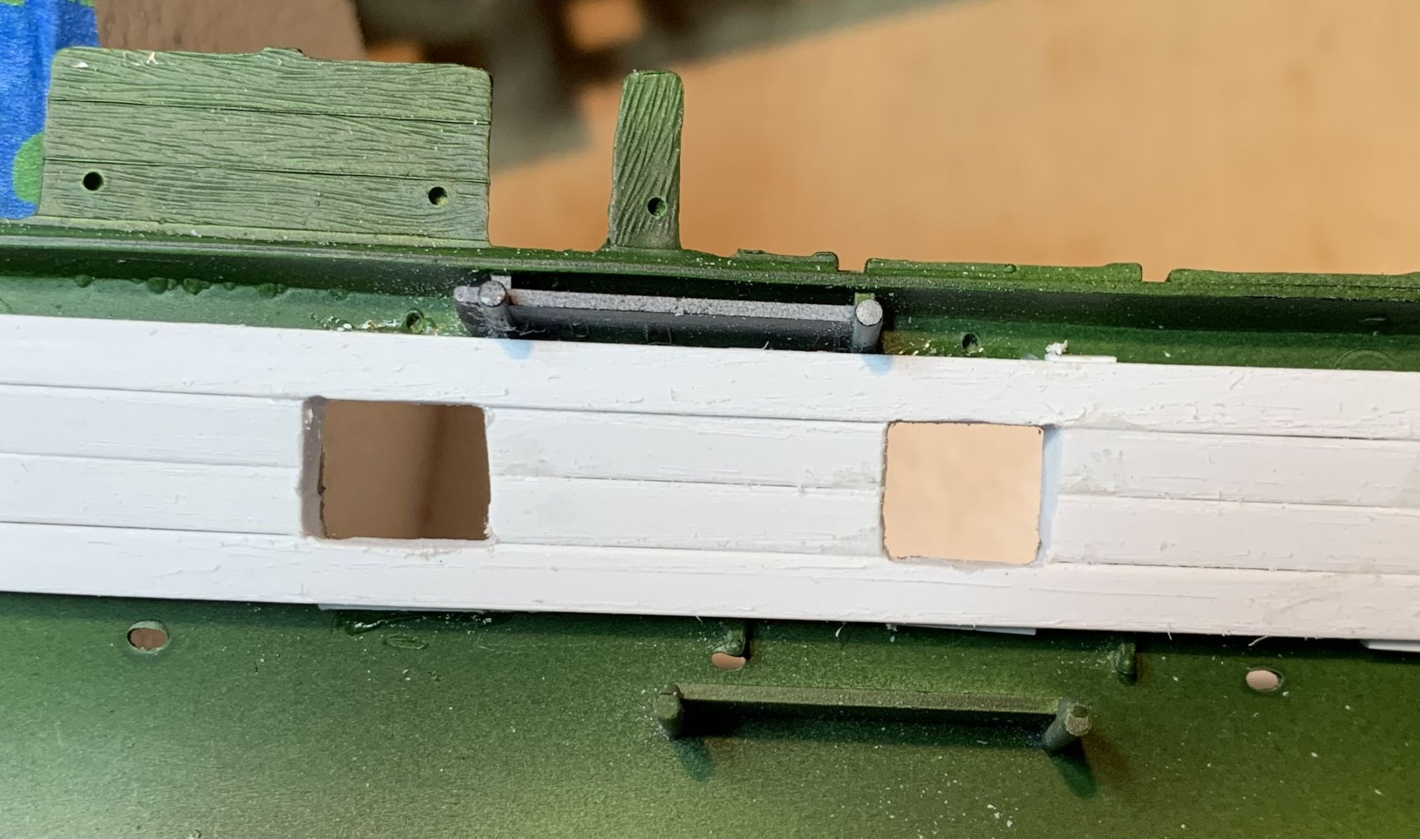 First attempt at cutting away on a model. Clearly don't have the proper  tools. Used a scriber and sanding sticks. What's the best tool for cutting  away pieces on plastic models? 