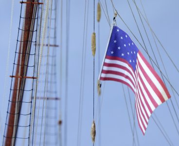 13 star US Flag rigged to port boom topping lift