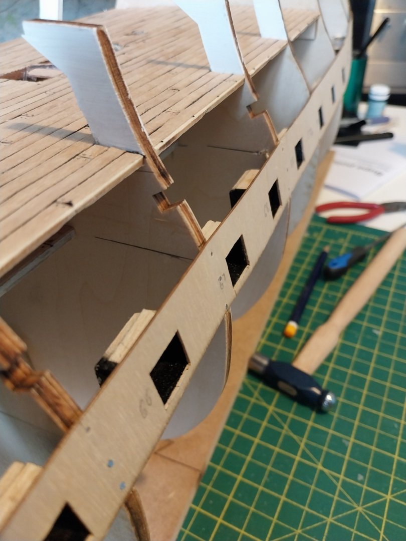 39 Attaching Sunken Lower Gun Ports to side panel and attacing to Hull.jpg